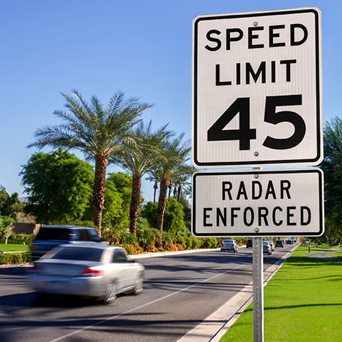 A speed limit street sign
