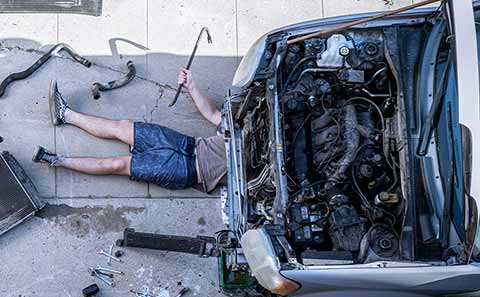 a person fixing a car